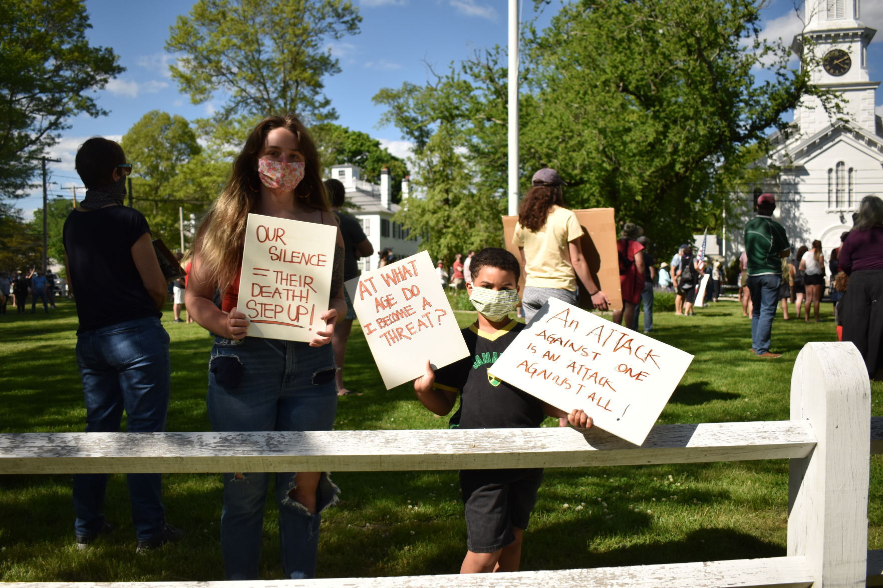 Hundreds Gather At Village To Confront Racism